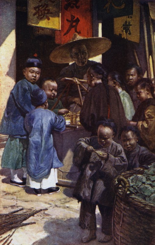 China: Jungen an einem Süßigkeitenstand von Norman Hardy