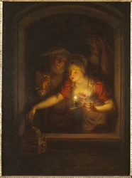 Eine Frau mit einer brennenden Kerze