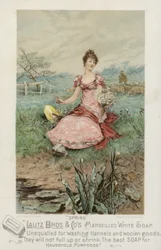 Dame sitzt auf Wiese