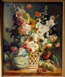 Blumen und Früchte in einem Weidenkorb