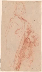 Ein stehender Mann mit Umhang und Handschuhen