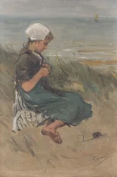 Mädchen, das in den Dünen strickt