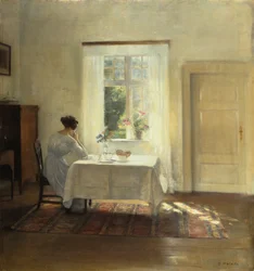Eine Frau sitzt an einem Tisch am Fenster, ca. 1900