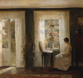 Eine Frau am sonnigen Fenster