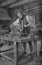 George Stephenson arbeitet an einem Modell seiner Rocket, der Lokomotive, die die Eisenbahn möglich machte (Lithografie)
