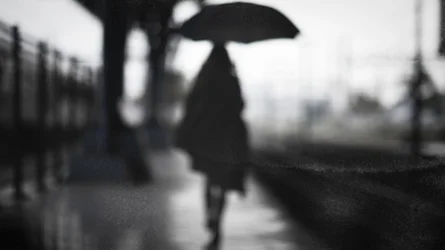 Einsame Gestalt im Regen