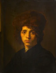 Junger Mann mit Pelzmütze