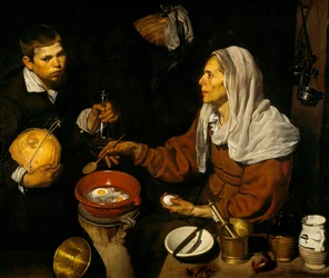 Eine alte Frau kocht Eier