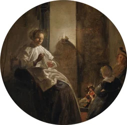 Eine Frau näht bei Kerzenlicht