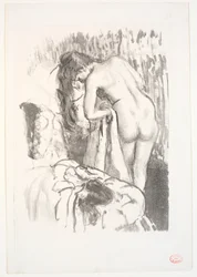 Stehende nackte Frau bei ihrer Toilette