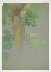 Frau sitzt unter einem Baum und liest