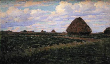 Heuhaufen auf einem grünen Feld
