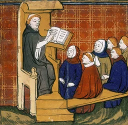 Dominikanischer Lehrer, sitzend mit Buch auf einem Lesepult, mit Schülern, die vor ihm auf dem Boden sitzen. "Livre des Proprietez des Choses", frühes fünfzehntes Jahrhundert.