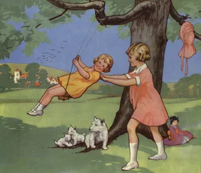 Mädchen spielen auf einer Schaukel in der englischen Landschaft