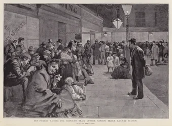 Hopfenpflücker warten vor dem London Bridge Bahnhof auf den Mitternachtszug nach Kent