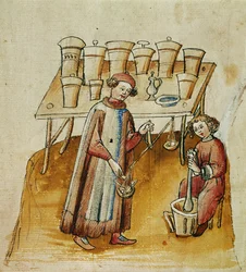 Ein Apotheker und sein Assistent zerstoßen Kräuter und Wurzeln für medizinische Zwecke, ca. 1380-1400
