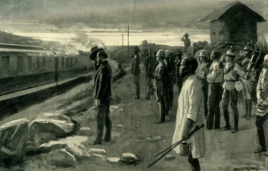 Der Zug, der die Überreste von Mr. Rhodes transportiert, wird von den Blockhauswachen begrüßt, 1902