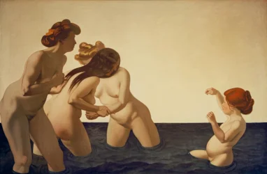 Drei Frauen und ein kleines Mädchen, die im Wasser spielen