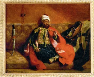 Türke, rauchend auf einem Diwan