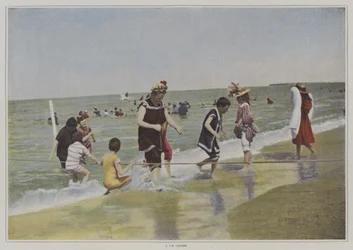 Kinder spielen mit einem Seil am Strand (Farbfoto)