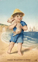 Junge mit Hund am Strand