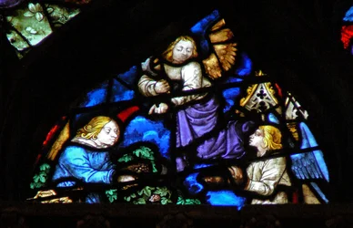 Das Westrosenfenster zeigt eine Szene aus dem Buch der Offenbarung: Traubenlese mit der Sichel (14:17-18).