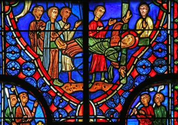 Fenster w11, St. Andreas an sein Kreuz gebunden und predigt der Menge
