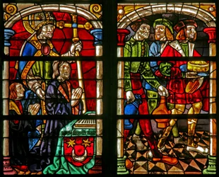Fenster w232 zeigt eine Szene aus der Geschichte vom verlorenen Sohn: drei Figuren beim Fest der Rückkehr des verlorenen Sohnes; links der Stifter und St. Wilhelm