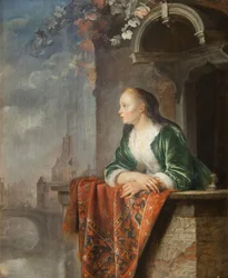 Junge Frau auf einem Balkon