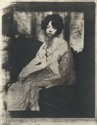 Sitzende Frau