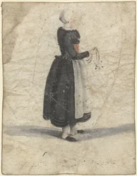 Nordholländische Frau stehend mit einem Ornament oder Tasche in der Hand