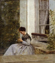 Eine Frau beim Häkeln