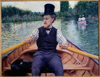 Teil des Bootes. Ein Mann mit hohem Hut rudert in einem Boot.
