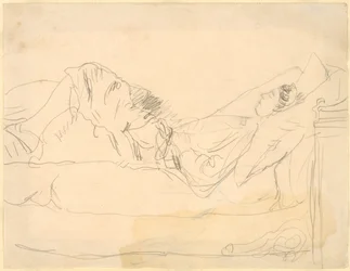 Mädchen liegt auf einem Bett