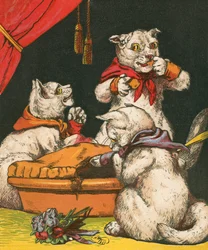 Unartige Kätzchen essen Kuchen in ihren Fäustlingen