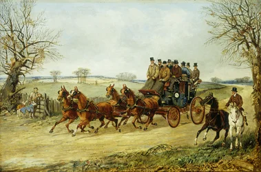 Eine Kutsche und vier Pferde auf einer Herbststraße