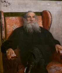 Leo Tolstoi in einem rosa Sessel