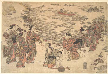 Frauen und ein kleiner Junge sammeln Muscheln am Strand