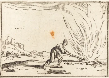 Mann bei einem Feuer