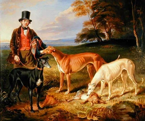 Thomas Harris, Hundewärter von Tom Llewelyn Brewer, mit Windhunden