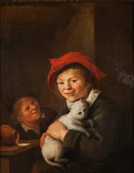 Zwei Jungen spielen mit einer Katze