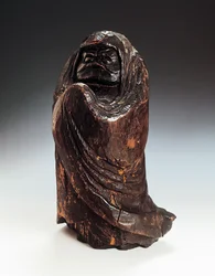 Statuette, die Daruma (Bodhidharma, Gründer und erster Patriarch des Zen) darstellt