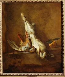Toter Hase mit rotem Rebhuhn