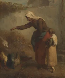 Frau füttert Hühner