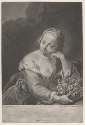 Frau mit einem Korb voller Früchte