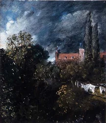 Blick in einen Garten mit einem roten Haus im Hintergrund