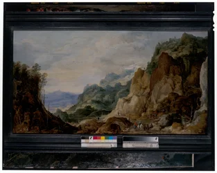 Panoramische Berglandschaft mit Handwerksburschen, die den Armen geben, Packpferde im Hintergrund