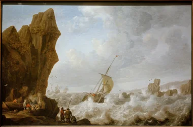 Fischerboot in stürmischer See vor einer felsigen Küste