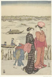 Zwei Frauen und ein Junge am Ufer eines Flusses