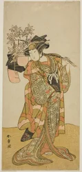 Der Schauspieler Yamashita Kinsaku II als Odai, ein Eboshi (Hut) Verkäufer, im Stück Hana-zumo Genji Hiiki, aufgeführt im Nakamura Theater im elften Monat, 1775